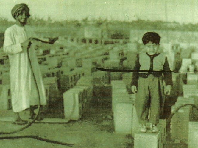 Old Photo Of Misan Al-Khamiri Standing On A Concrete Block As A Child
