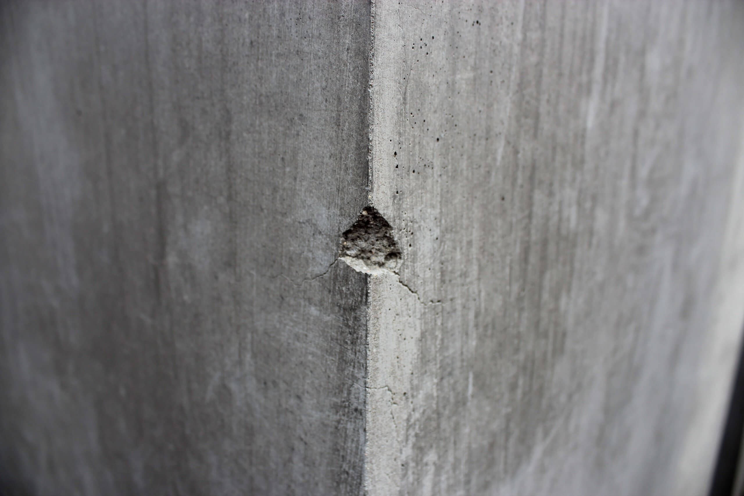 crack on grey concrete corner