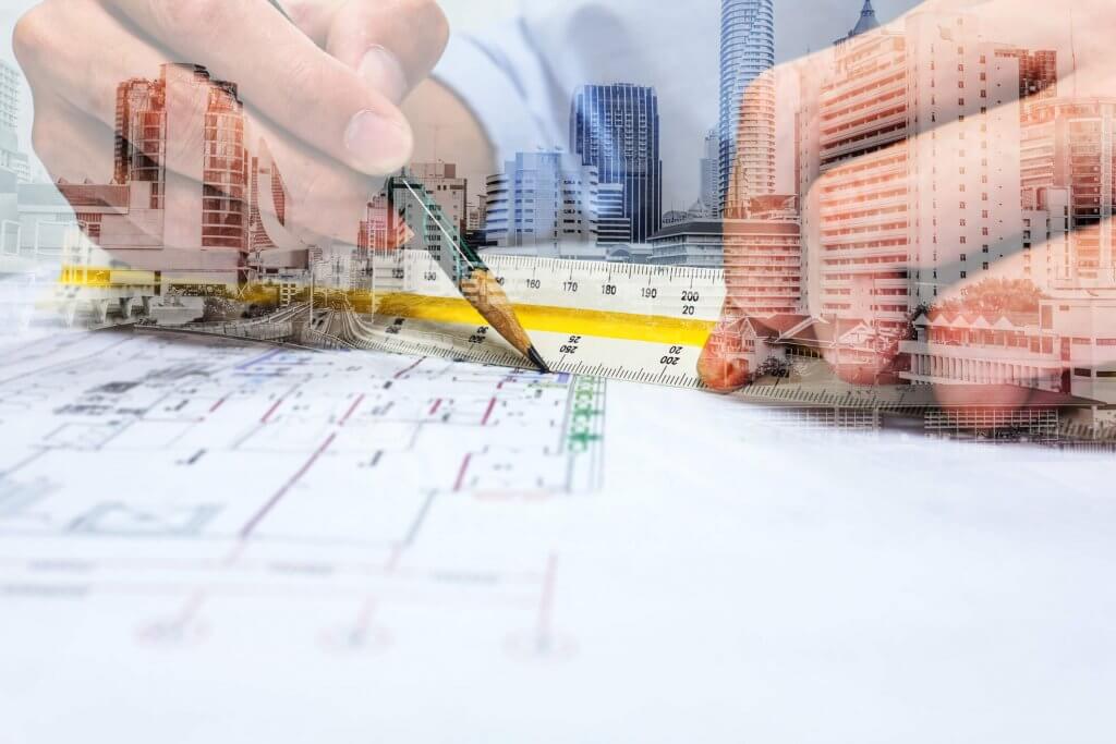 double exposure image of engineer using pencil and ruler to measure distance with cityscape overlay